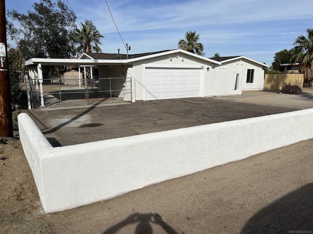 view of front of home featuring a carport and a garage