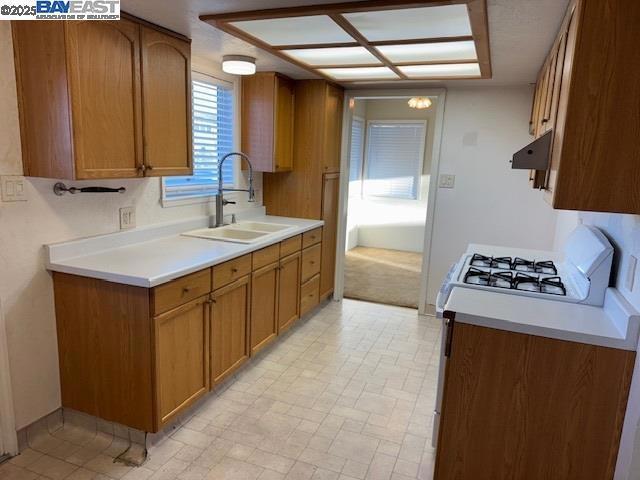 kitchen featuring sink and gas range gas stove