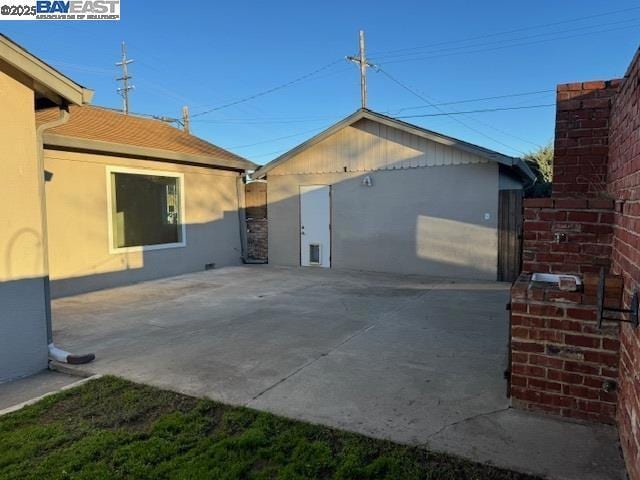 view of side of property with a patio