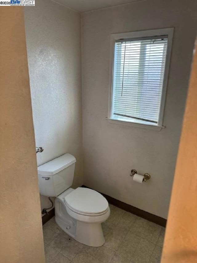 bathroom featuring toilet