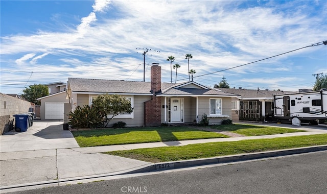 ranch-style home featuring a garage and a front yard