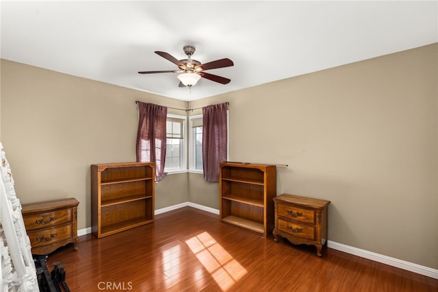 unfurnished bedroom with wood finished floors and baseboards