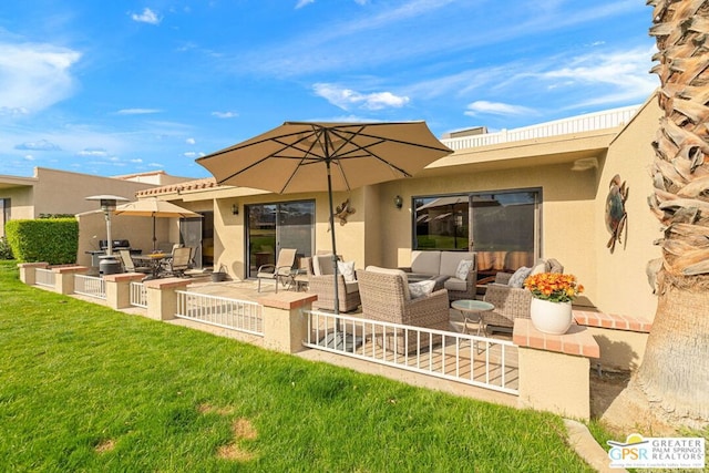 back of house with a yard, outdoor lounge area, and a patio