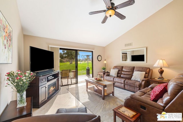 tiled living room with high vaulted ceiling and ceiling fan