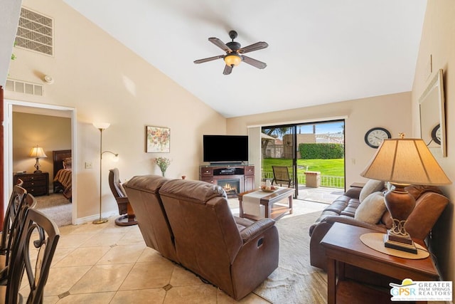 living room with high vaulted ceiling, ceiling fan, and light tile patterned floors