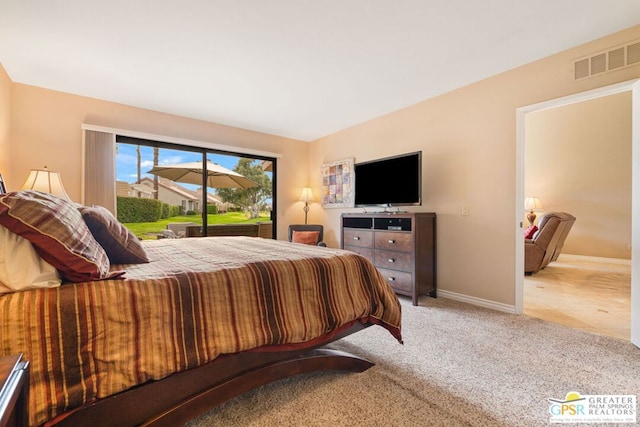 bedroom featuring light carpet