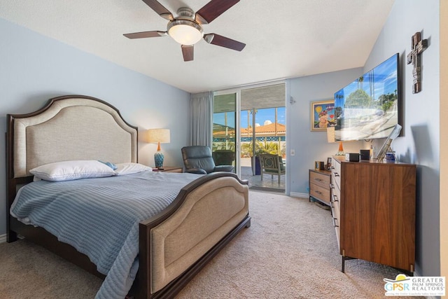 carpeted bedroom featuring access to outside and ceiling fan