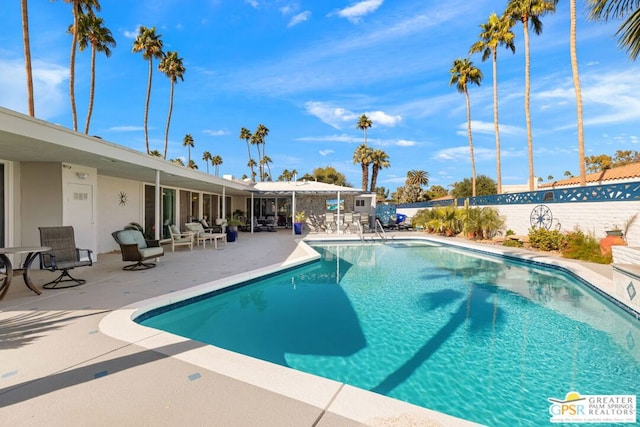 view of swimming pool featuring a patio area