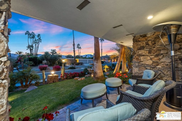 patio terrace at dusk with a lawn