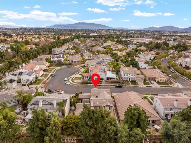 birds eye view of property with a mountain view