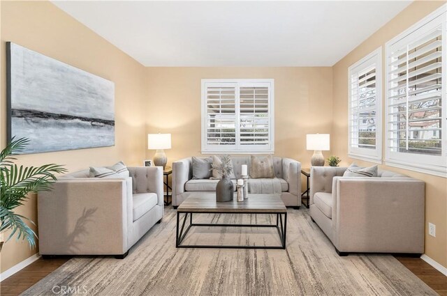 living room with plenty of natural light and light wood-type flooring