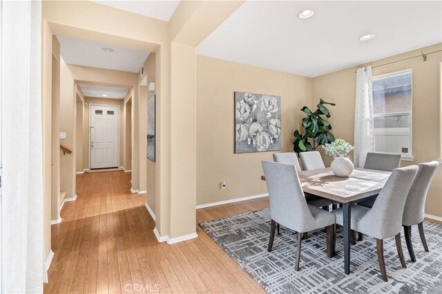 dining space featuring light wood-type flooring