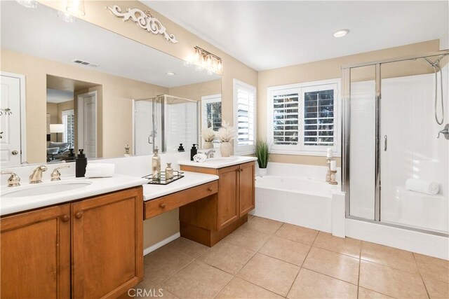 bathroom with independent shower and bath, tile patterned flooring, and vanity