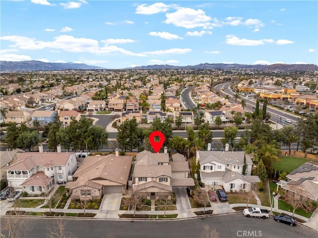 birds eye view of property with a mountain view