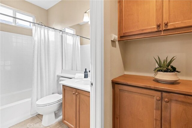 full bathroom with tile patterned floors, vanity, toilet, and shower / bath combination with curtain