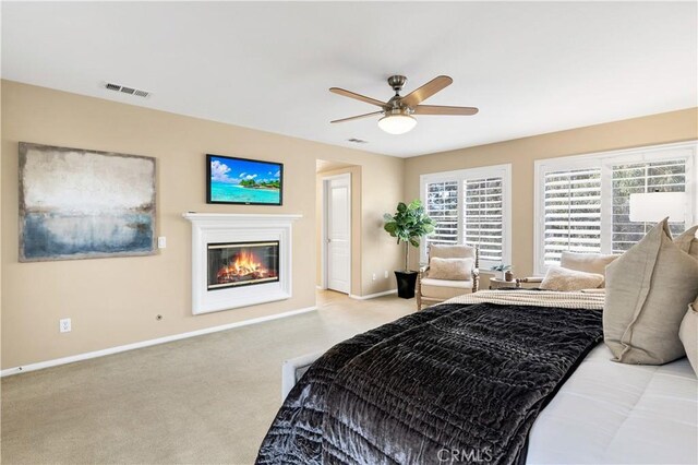 carpeted bedroom with ceiling fan