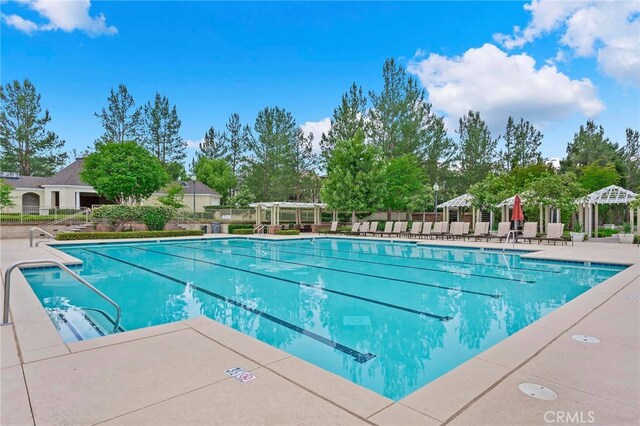 view of pool with a patio area and a pergola