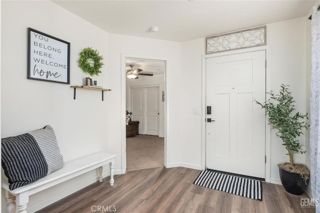 entrance foyer with ceiling fan and dark hardwood / wood-style flooring