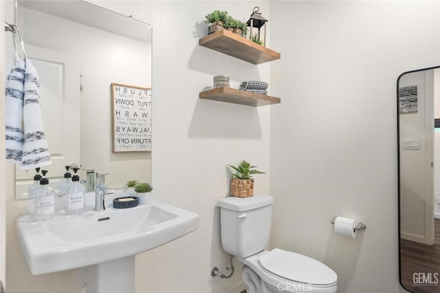 bathroom with toilet and sink