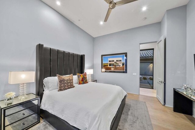 bedroom featuring ceiling fan and light hardwood / wood-style flooring