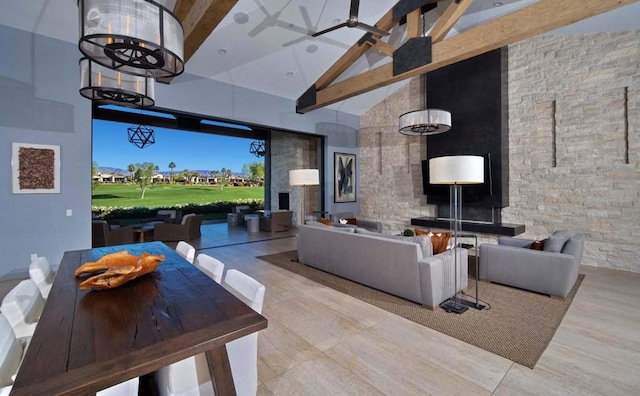 living room with high vaulted ceiling and beamed ceiling