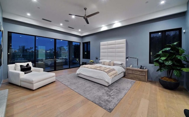 bedroom with access to exterior, ceiling fan, and light hardwood / wood-style flooring