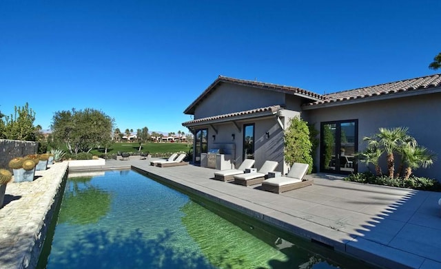 rear view of property with a patio area