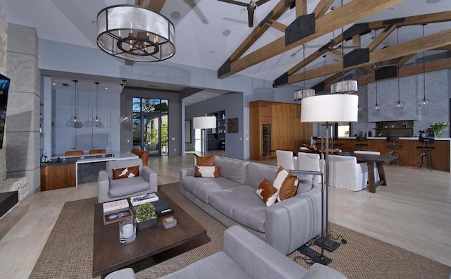 living room featuring an inviting chandelier, high vaulted ceiling, and beamed ceiling