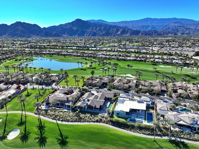 birds eye view of property featuring a water and mountain view