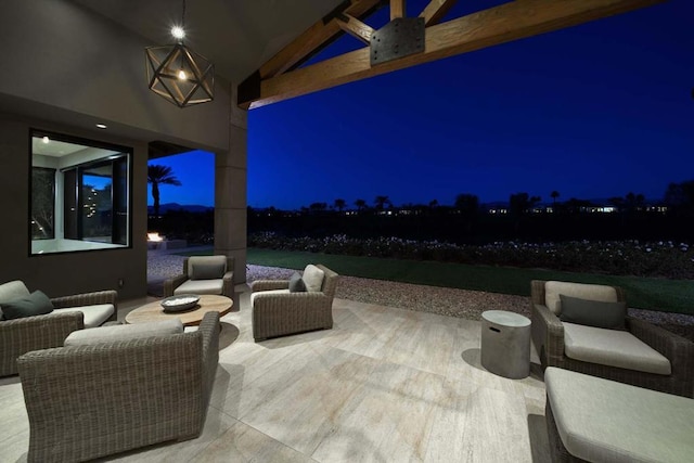 patio at twilight featuring an outdoor living space