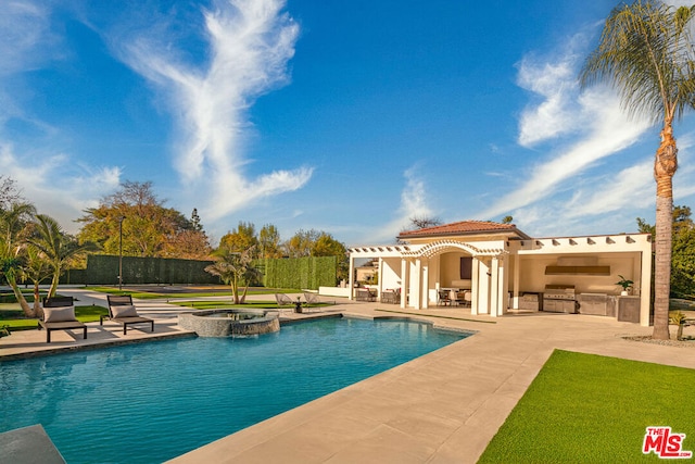 view of swimming pool with a patio, a pergola, exterior kitchen, a grill, and an in ground hot tub