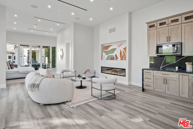 living room featuring light wood-type flooring and french doors