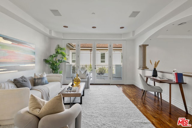 living room with french doors and dark hardwood / wood-style floors