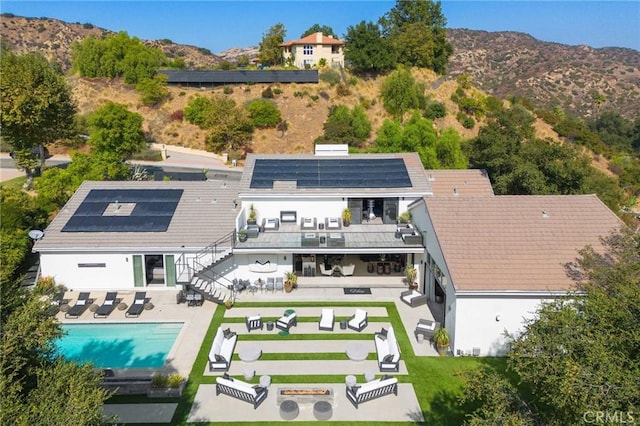 birds eye view of property with a mountain view