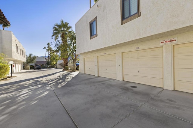 view of side of property with a garage