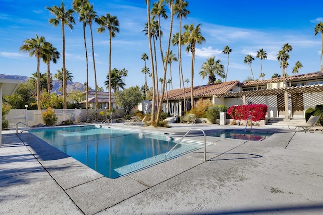 view of pool with a pergola and a patio