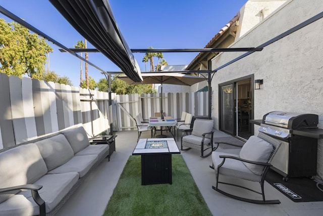 view of patio / terrace with grilling area, an outdoor living space with a fire pit, and a pergola