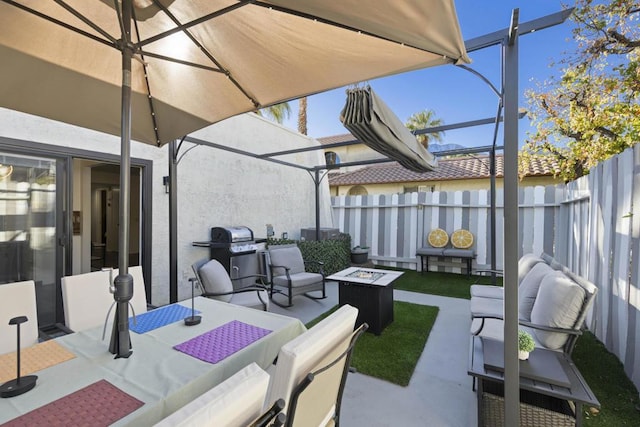 view of patio / terrace featuring an outdoor fire pit and grilling area