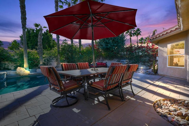 view of patio terrace at dusk