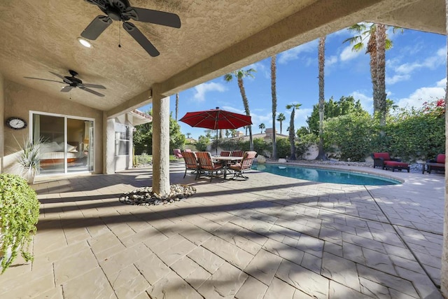 view of swimming pool with a patio and ceiling fan