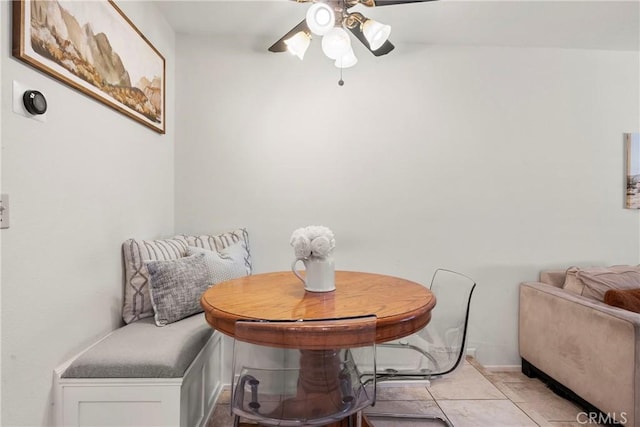 dining room featuring ceiling fan and light tile patterned flooring