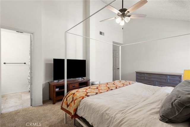 carpeted bedroom with high vaulted ceiling and ceiling fan