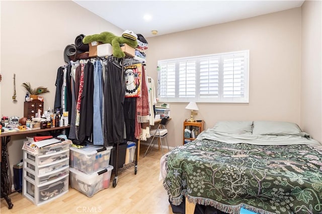 bedroom with wood-type flooring