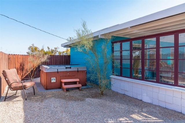 view of patio / terrace featuring a hot tub