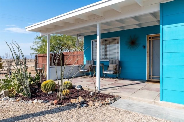 doorway to property with a patio area