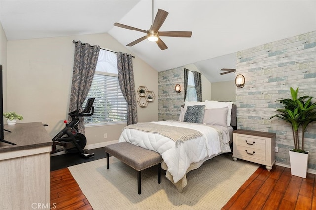 bedroom with ceiling fan, dark hardwood / wood-style flooring, and lofted ceiling