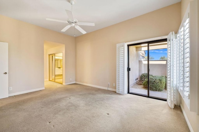 unfurnished room with ceiling fan and light colored carpet