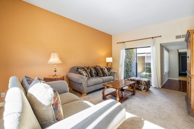 living room featuring light carpet