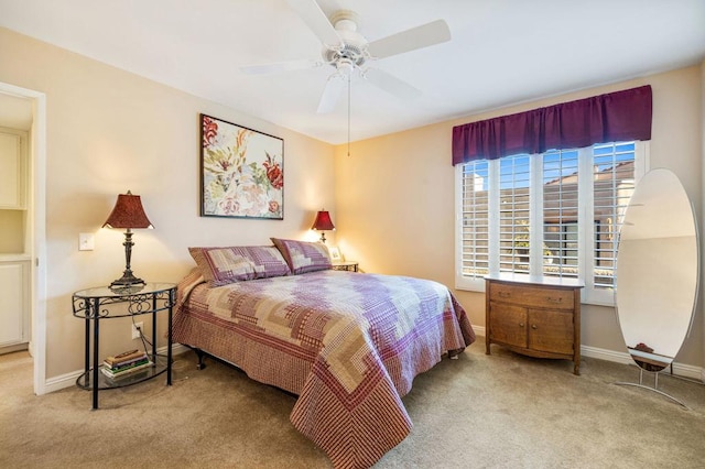 bedroom with ceiling fan and light carpet