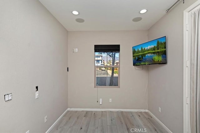 unfurnished room featuring light wood-type flooring